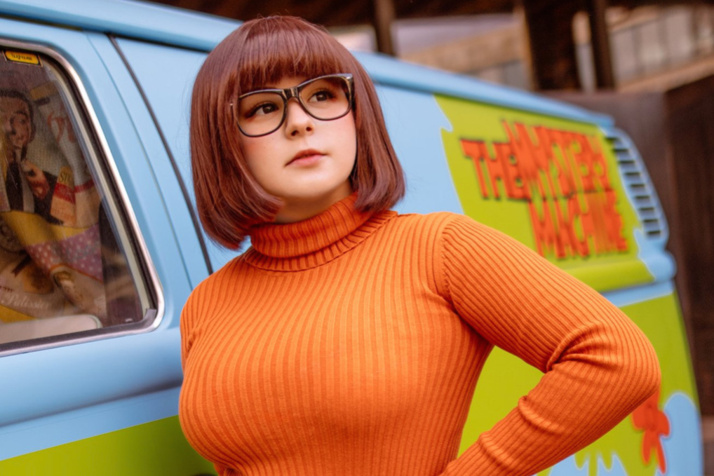 A person is dressed as Velma from Scooby Doo as a last minute Halloween costume