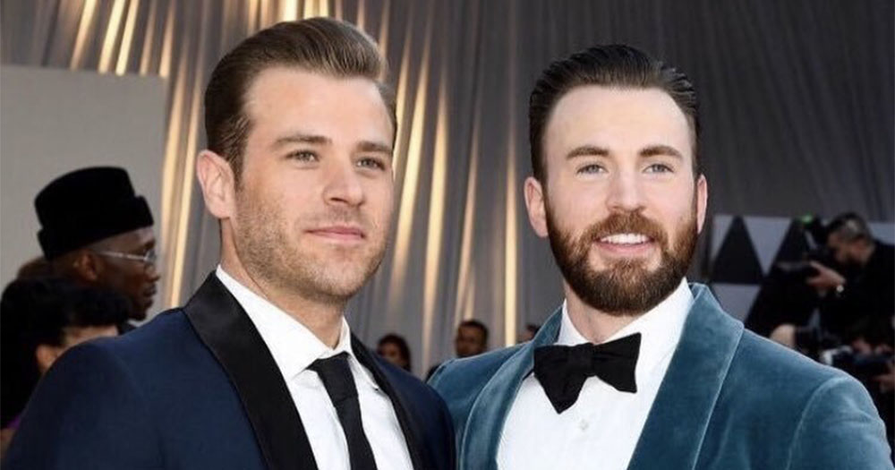 Chris and Scott Evans, pose on the red carpet.
