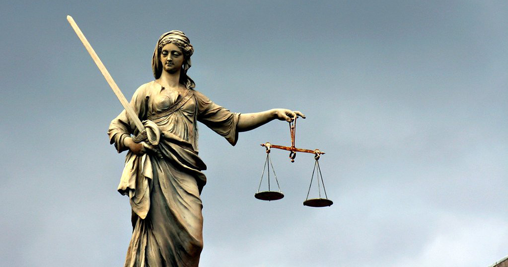 (Disregard Scheme) Dublin's Lady Justice statue against a grey sky.