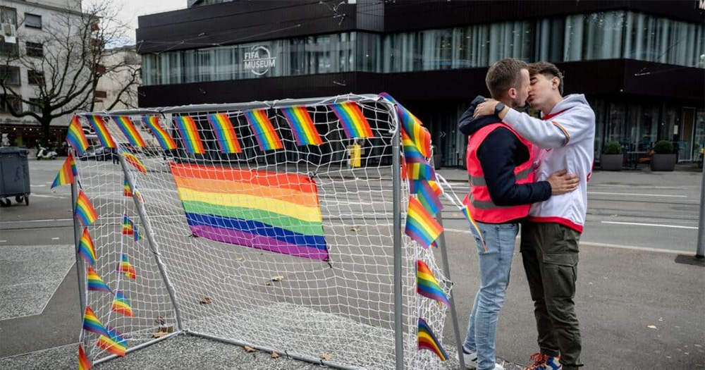 All Out actitist kiss outside FIFA museum in protest of antli LGBTQ+ laws in Qatar.