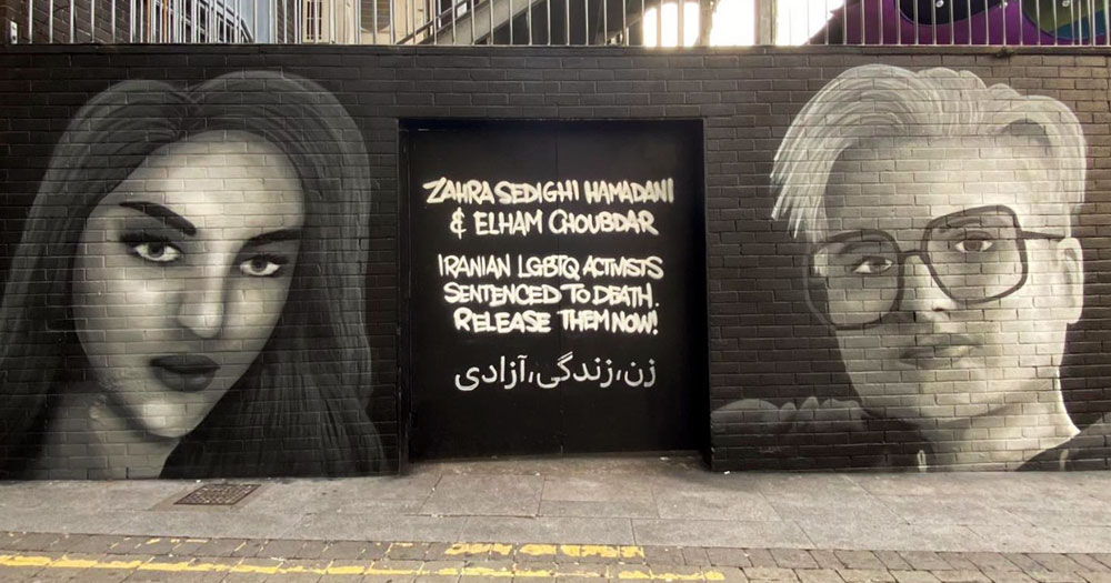 The George mural showing two activists and text.