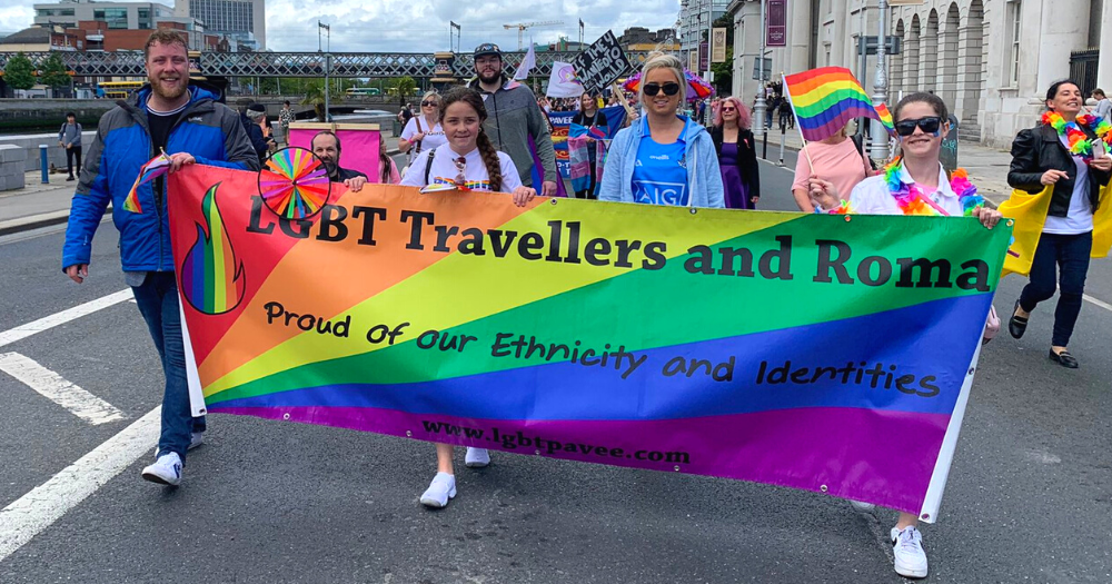 People supporting LGBTQ+ Travellers and Roma marching down Dublin during Dublin Pride 2022.