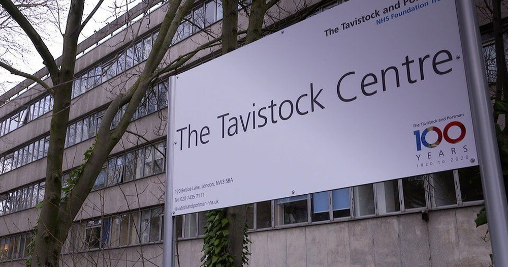 The picture shows a sign saying, ‘The Tavistock Centre,’ where gender identity specialists treat patients presenting with gender diverse identities.