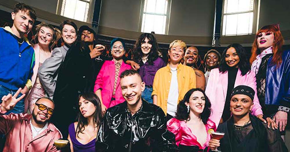 A group of creative activists pose together in Olly Alexander's ‘The Absolut Choir’