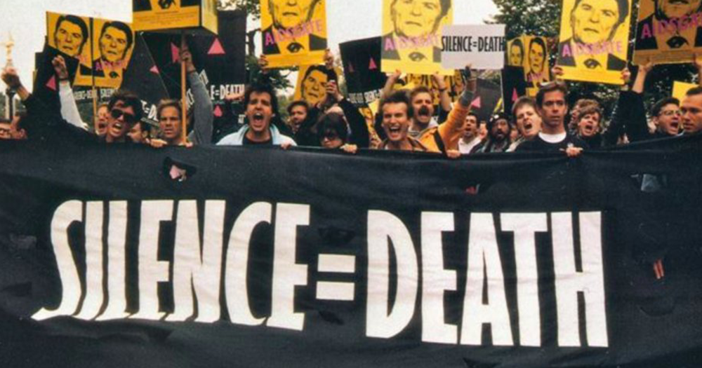 AIDS activists marching with a Silence=Death banner.
