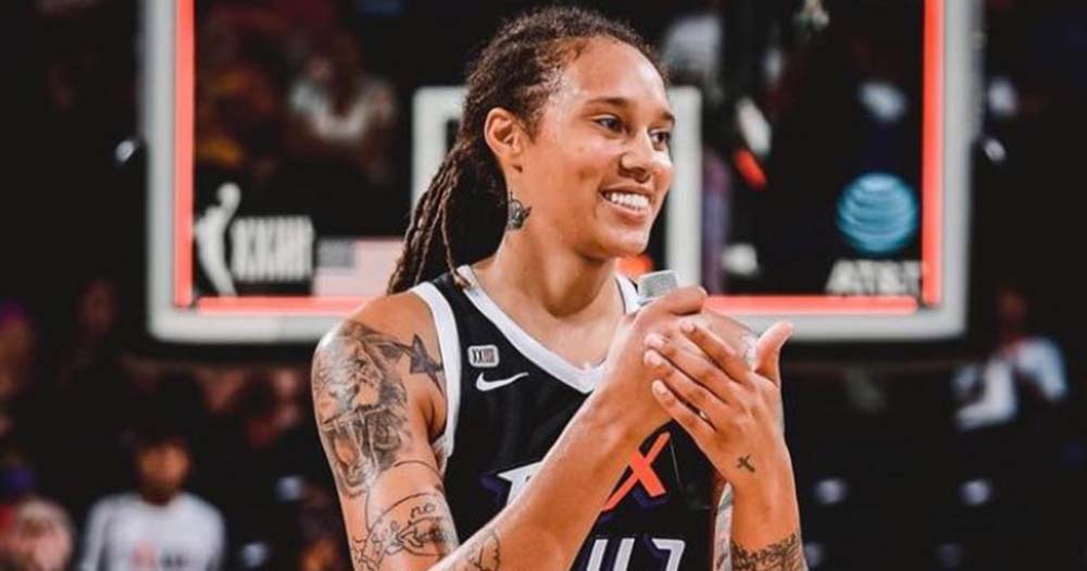 US basketball player Brittney Griner smiles in her basketball journey, she has been released by Russia in a prisoner swap and is now on her way home.