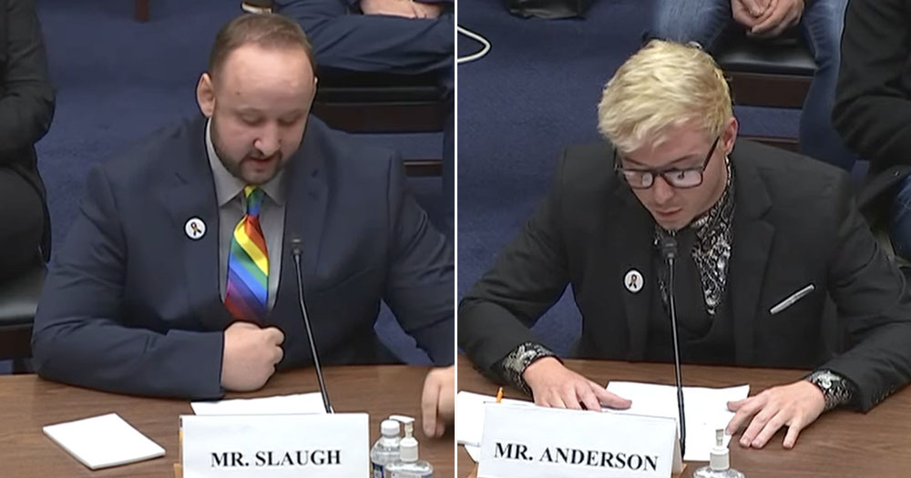 The image shows a split screen of two of the survivors of the Club Q shooting as they give testimony to Congress. Both men are looking downwards reading from sheets of paper. The man on the left has a name plate reading "Mr Slaugh" and the man on the left has a name plate reading "Mr Anderson".