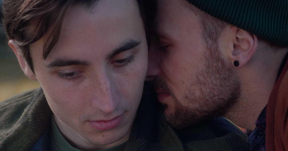 Two characters, Bartek and Dawid, in the queer movie Elephant, are seen snuggling up to each other.