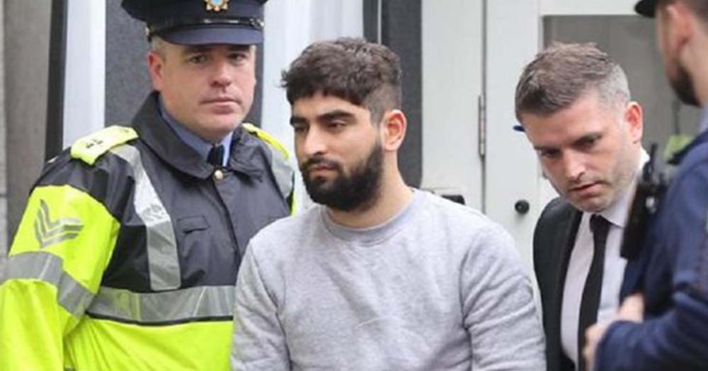 Man in gray shirt, Yousef Palani, walking with gardi, the Sligo suspect charged with murder will face trial in November. 