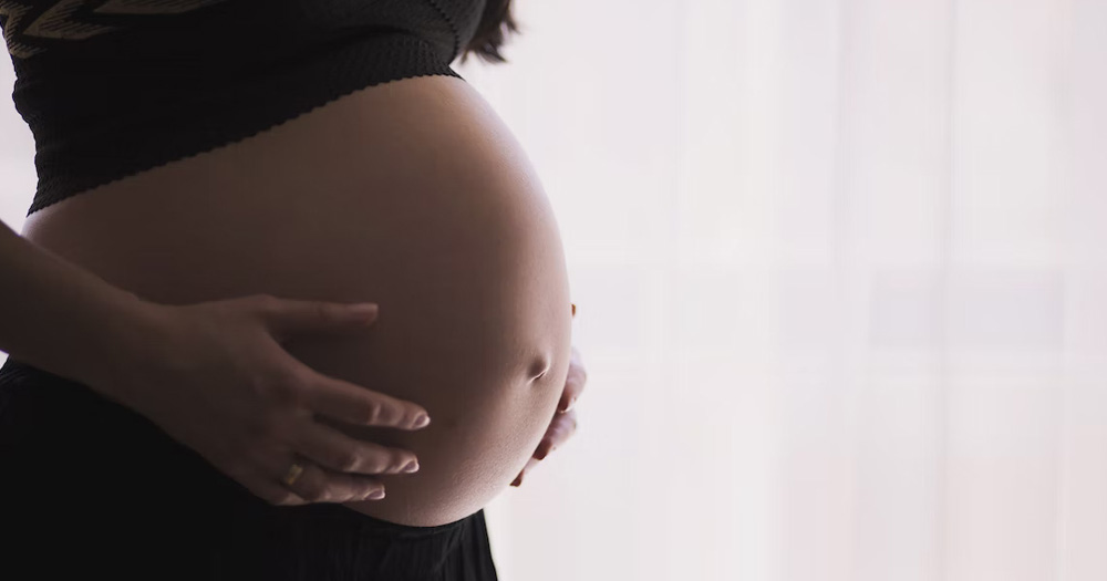 A photo of a woman pregnant through surrogacy.