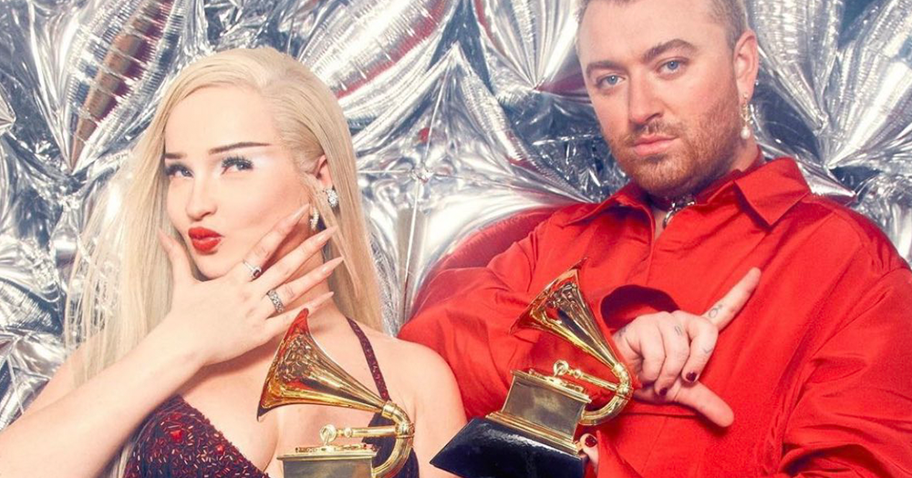 Kim Petras and Sam Smith pose in front of a metallic silver balloons after Kim becomes the first openly trans woman to win a Grammy, in her speech she referenced trans icons who came before her.
