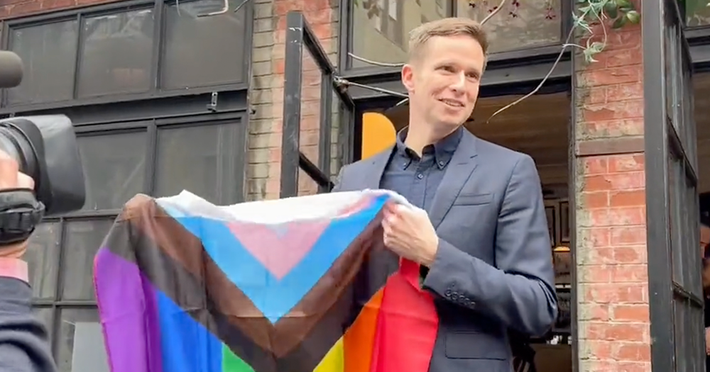 A city council member in New York holds progress Pride flag in response to attacks that have impacted the LGBTQ+ community in the U.S.