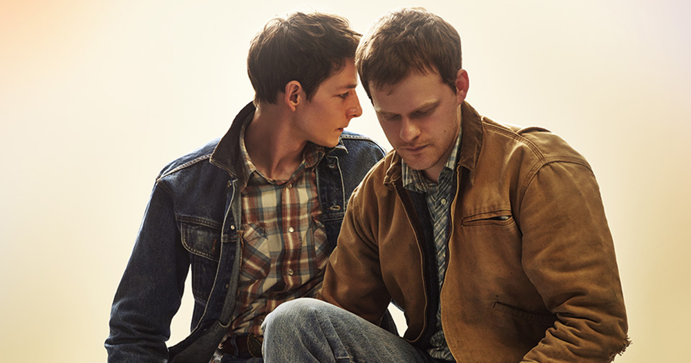 Two male actors pose side by side in promotional photo for the Brokeback Mountain play