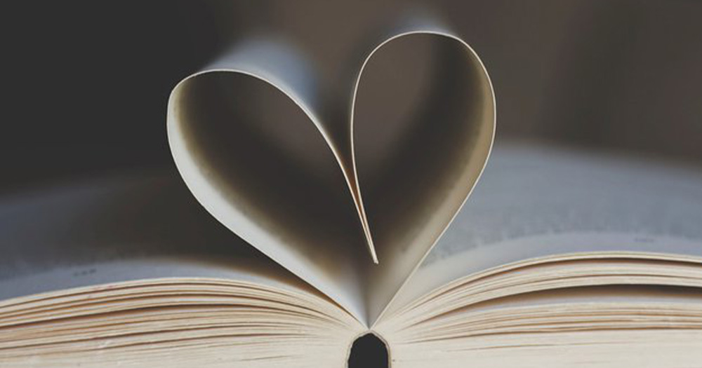 A library book with the pages folded in the shape of a heart.