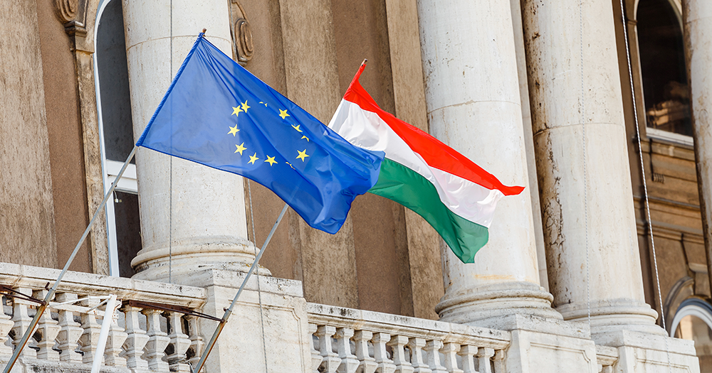 EU and Hungary flag flying side-by-side.