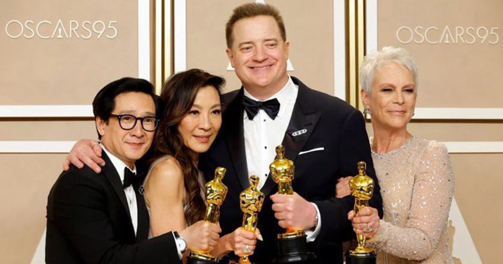 Four of the 2023 Oscars winners posing with their statuettes.