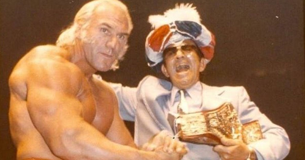 Wrestling manager Ernie Roth and a wrestler winning a prize.