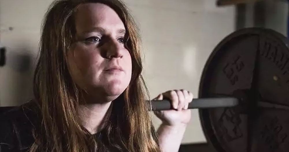Trans athlete JayCee Cooper, who just won a lawsuit against USA Powerlifting, lifting weights.