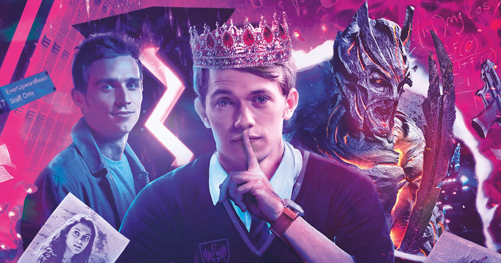 The image is the title graphic for the new volume in the Class series of Doctor Who. In the middle is a boy wearing a crown with his finger over his lip. To his left is another boy and to his right is a monster.