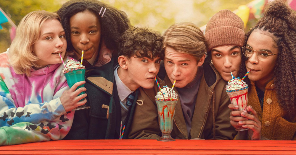 Promotional photo for Heartstopper Season 2, featuring the main actors from the cast drinking smoothies.