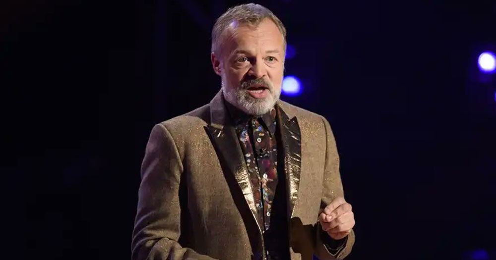 Graham Norton, who will host a new Irish comedy show, on a stage talking to the crowd.