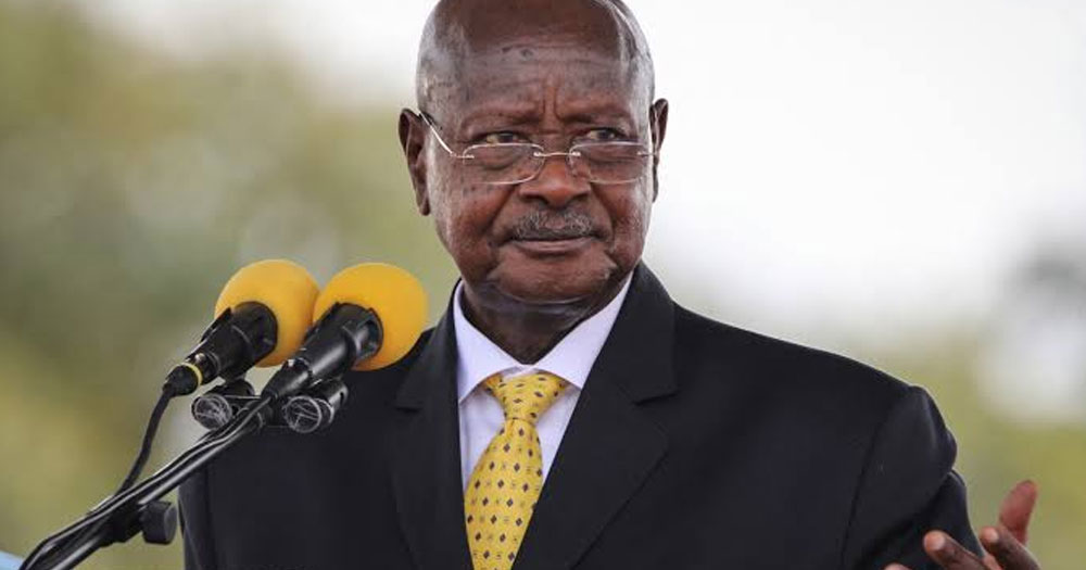 Ugandan President Yoweri Museveni , who has refused to sign an anti-LGBTQ+ bill, speaking to a microphone at an event.