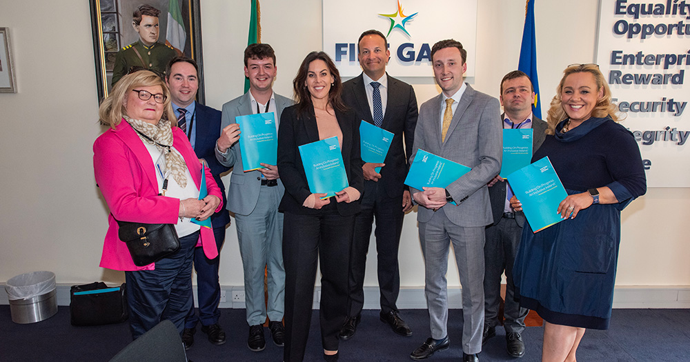 Fine Gael LGBTQ+ posing with Leo Varadkar and the new policy document.