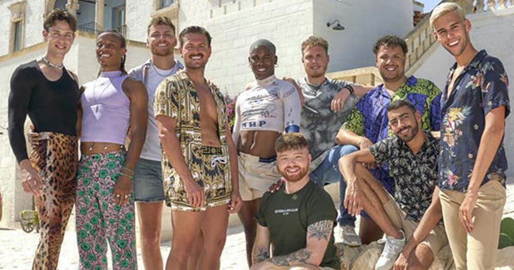 Contestants from the UK’s first-ever gay dating reality show smile and pose side-by-side.