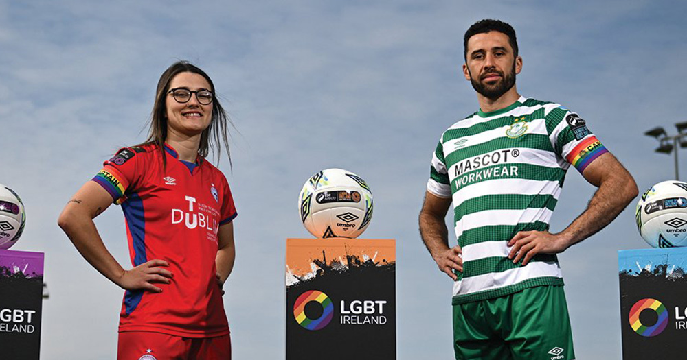 League of Ireland players Keeva Keenan and Roberto Lopes in kits with a football between them.