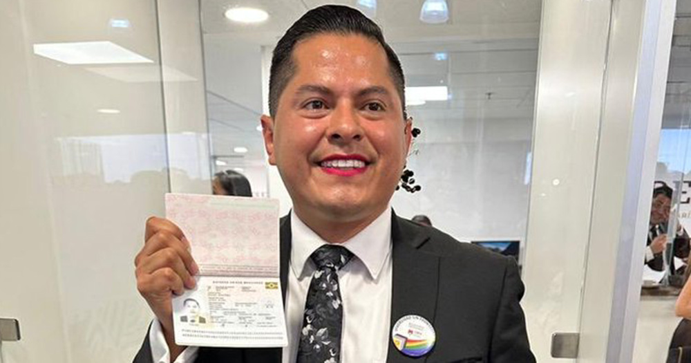 A person posing with the first non-binary passport in Mexico.