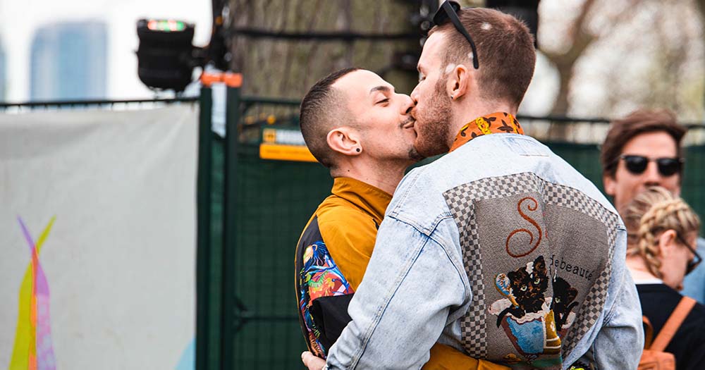 Two men kissing marking sexual health campaign in Ireland.
