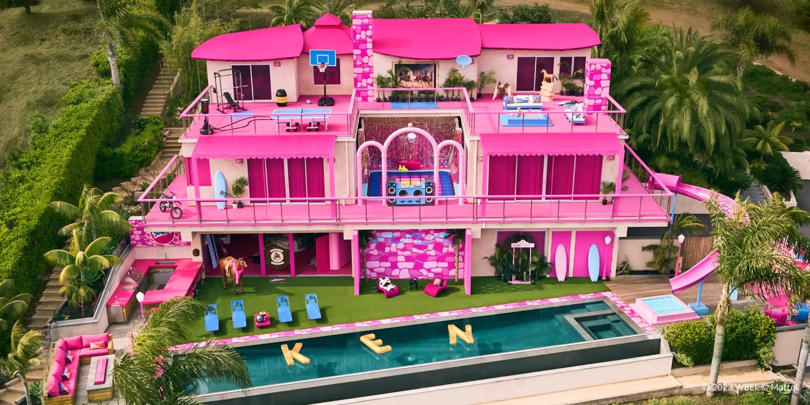 An image of the real-life Barbie DreamHouse, a bright pink mansion in Malibu that is being offered as an Airbnb rental for lucky guests.