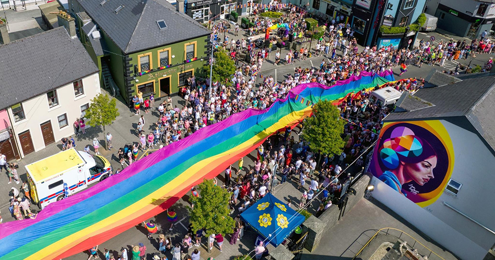 Aerial view of long rainbow flag at Inishowen Pride in Donegal.