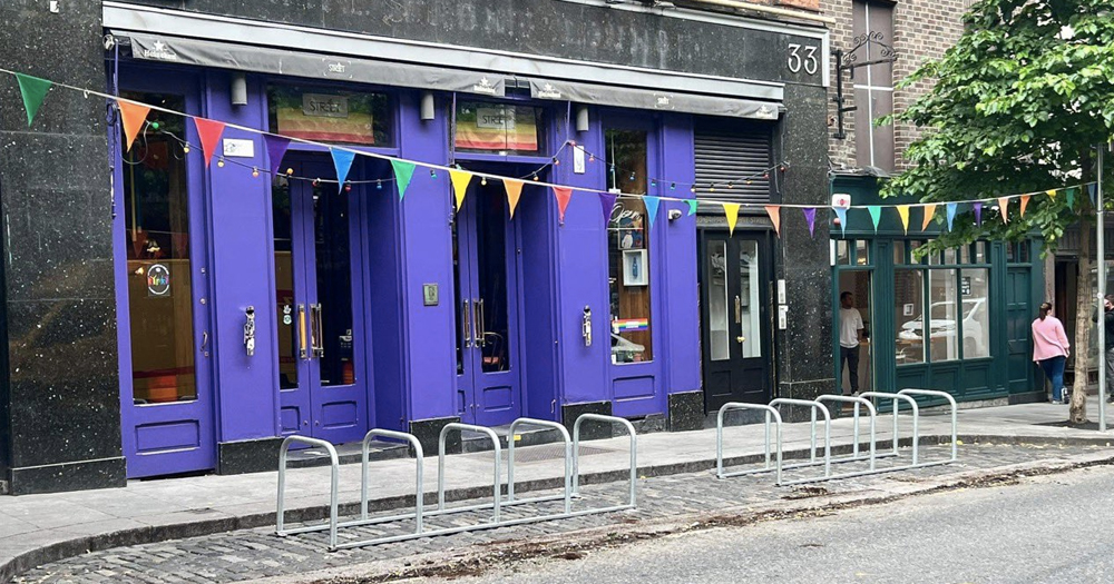 Outside view of LGBTQ+ bar Street 66, with bike racks installed at the front.
