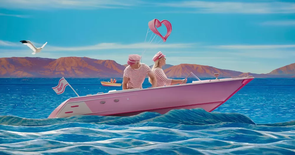 A still from the Barbie movie of Barbie and Ken on a boat.