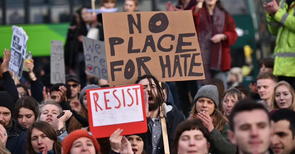 This article is about the hate crime law in Ireland. In the photo, people protesting with banners that read "no place for hate".