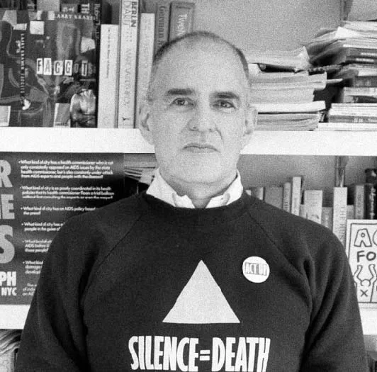 Larry Kramer, one of the LGBTQ+ historical figures wears a Silence = Death activist shirt