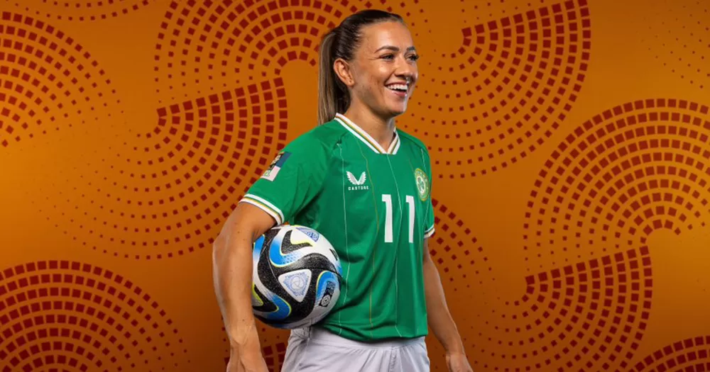 Katie McCabe posing with a football for a World Cup promo photo.