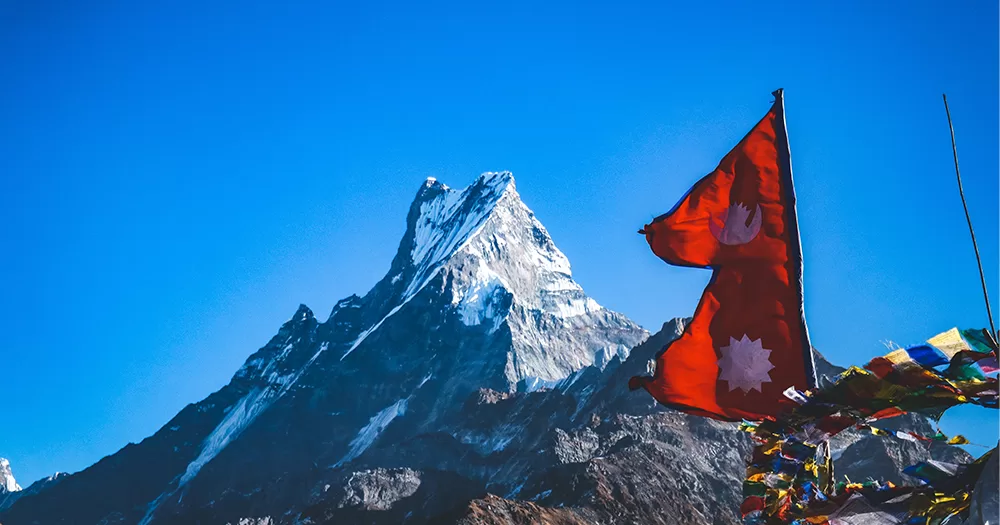 Flag of the country of Nepal with a mountain in the background. Nepal recently became the second Asian country to recognise same-sex marriages.