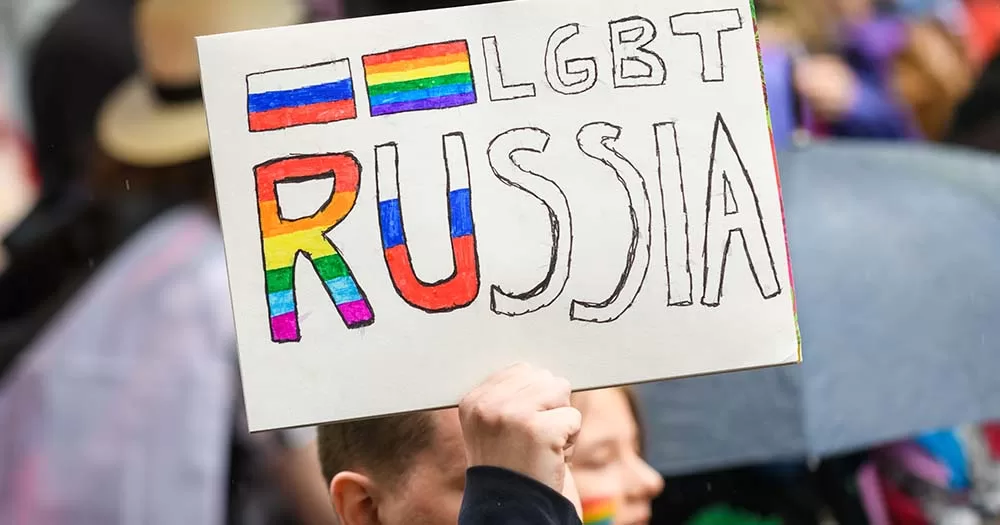 Protestor holds sign that reads LGBT Russia representing new legislation banning transgender healthcare.