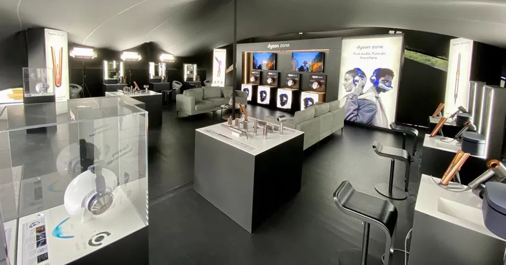 Image of the Dyson Zone, similar to the one at Electric Picnic. The furniture is grey and Dyson products are on display.