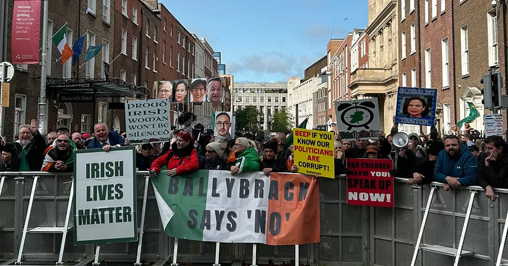 Photo of the barricade at yesterday's protest at Leinster House. A group of people can be seen holding signs like "Irish lives matter" and "Ballybrack says 'No'".