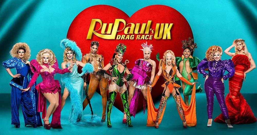 drag queens pose side by side in front of red heart with text saying RuPaul's Drag Race promoting season five of the series.