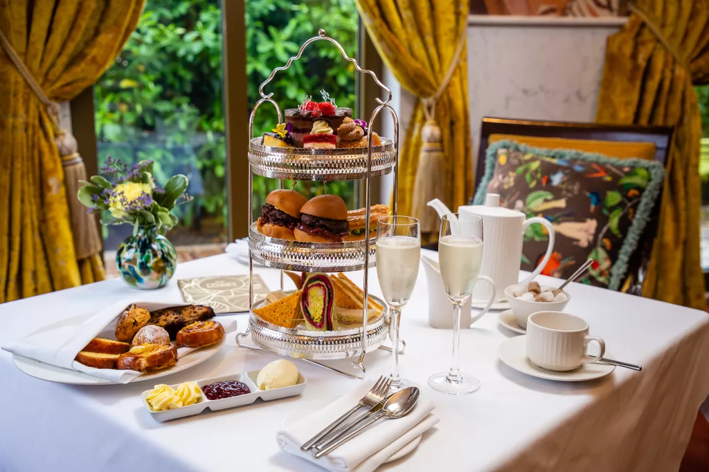 Afternoon Tea at Lawlor's of Naas, with a selection of sweet and savoury food on a table.