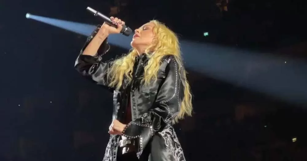 Madonna performs AIDS tribute on stage wearing black costume