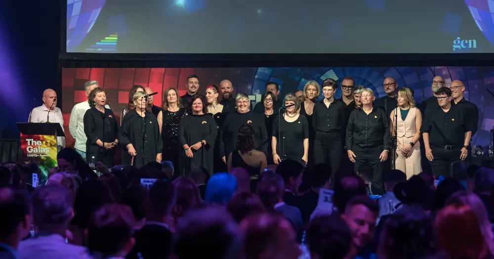 This article is about Gloria LGBT+ Choir Annual Christmas concert. In the image, members of Gloria LGBT+ Choir performing on the stage at the 2023 GALAS Awards.