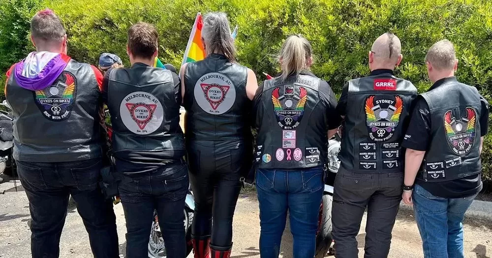 A photo of Dykes on Bikes Melbourne members facing away from the camera