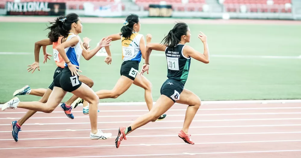 This article is about Hong Kong hosting the Gay Games. In the photo, athletes running on a track.
