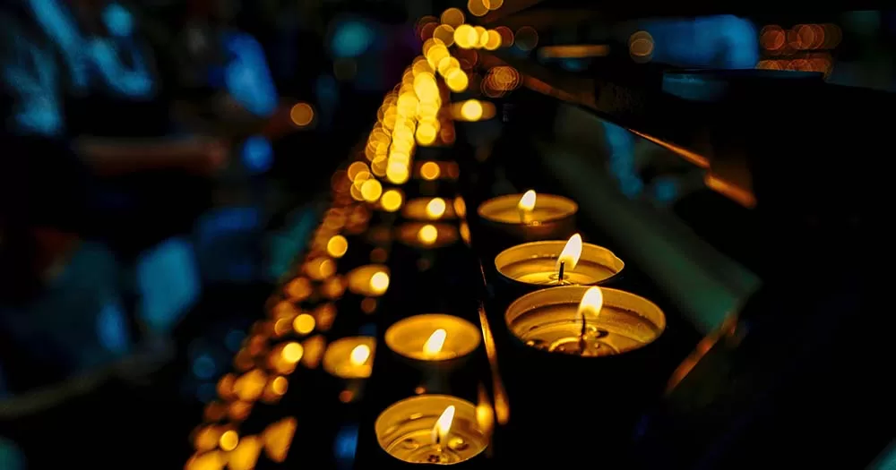 Photograph of series of candles representing the TENI transgender day of remembrance service