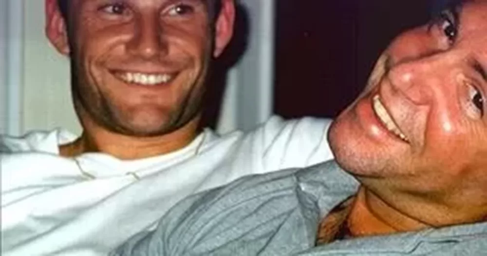 This image shows online gay dating platform Gay.Net founder Andy Cramer (right) and his husband Al Farmer (left).